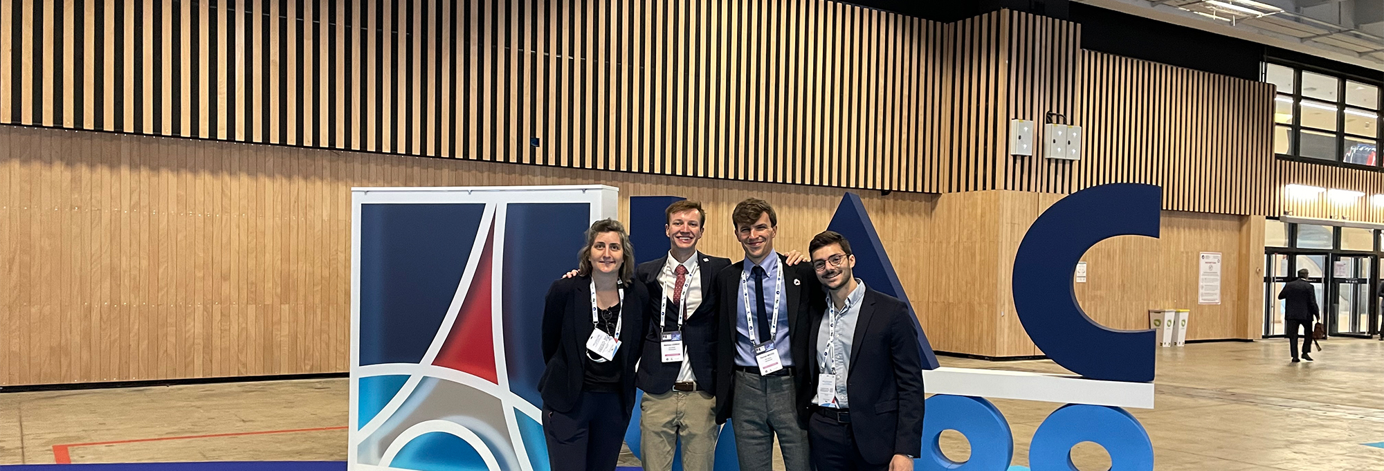 eSpace team in front of the IAC logo